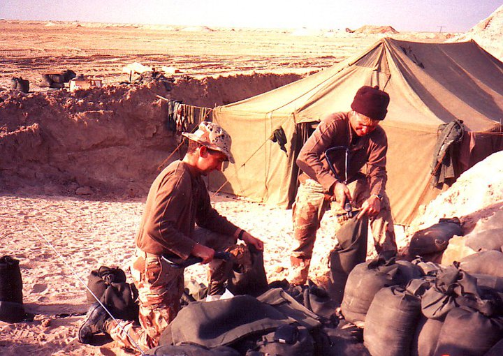 Filling sandbags the day the "air war" started. The aid station tent is in a culvert dug out by bulldozers to minimize our exposure to incoming rockets. Fortunately, only a few came in our area and none came close enough to do damage.